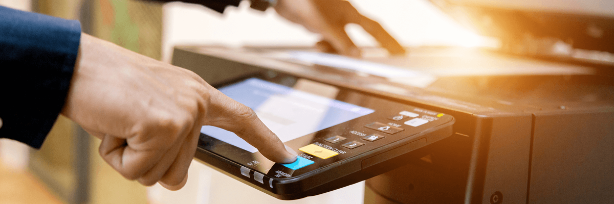 Man using printer touch screen