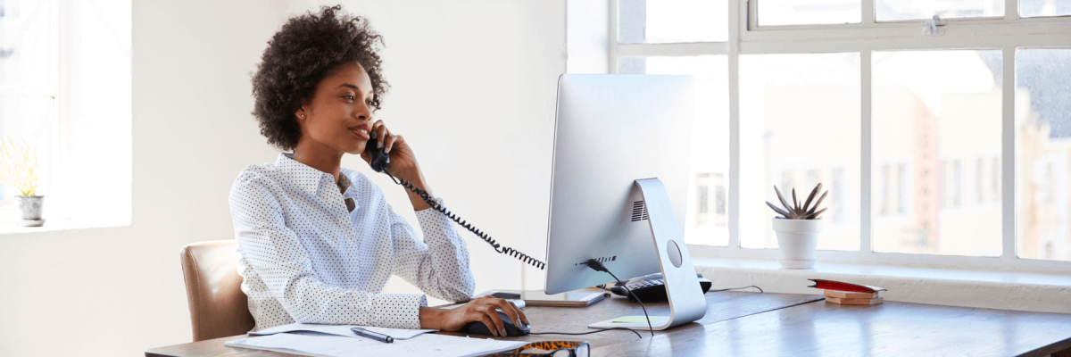 woman discussing next gen managed print over phone