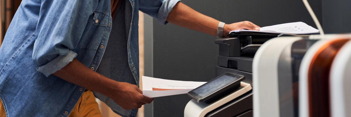 man using printer in office